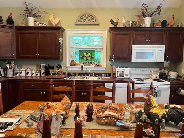 kitchen with white appliances and sink