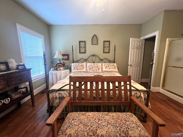 bedroom featuring dark hardwood / wood-style floors and ceiling fan