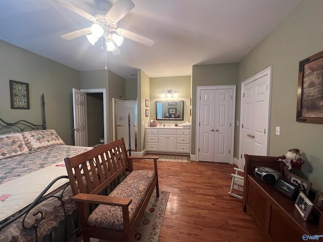 bedroom featuring wood-type flooring, connected bathroom, and ceiling fan