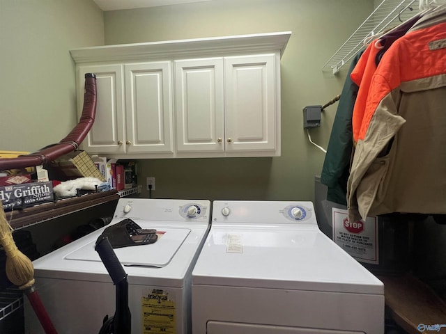 laundry area with washing machine and dryer and cabinet space