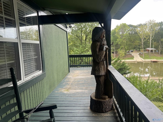 wooden deck with a water view