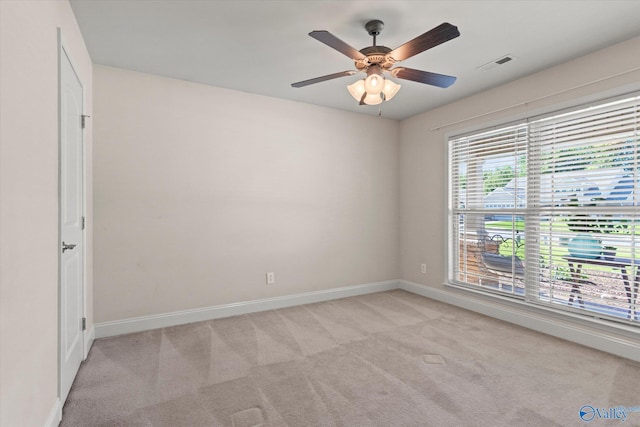 5008 Montauk Trl, Owens Cross Roads, AL 35763 - spare room featuring baseboards, light carpet, and ceiling fan