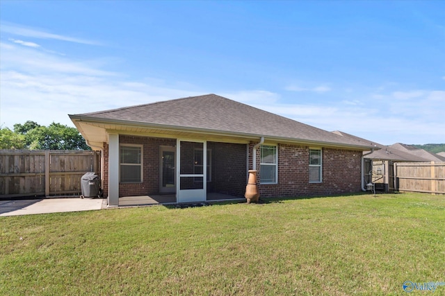 5008 Montauk Trl, Owens Cross Roads, AL 35763 - back of house with brick siding, a patio area, a sunroom, and a shingled roof