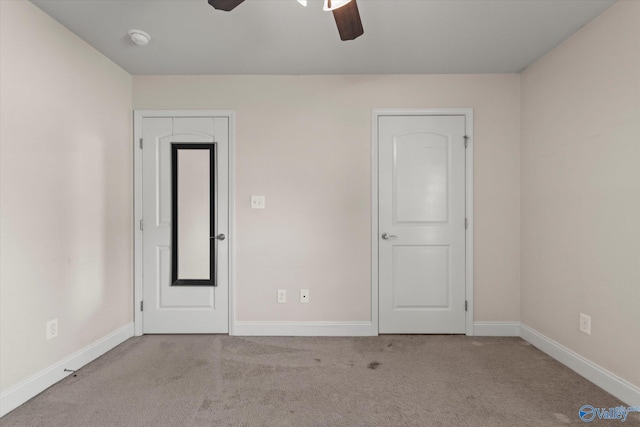 5008 Montauk Trl, Owens Cross Roads, AL 35763 - unfurnished bedroom with carpet, baseboards, and a ceiling fan