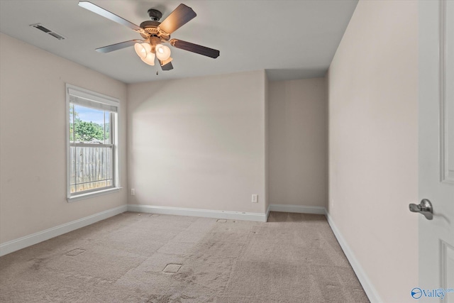 5008 Montauk Trl, Owens Cross Roads, AL 35763 - empty room featuring light colored carpet, a ceiling fan, and baseboards
