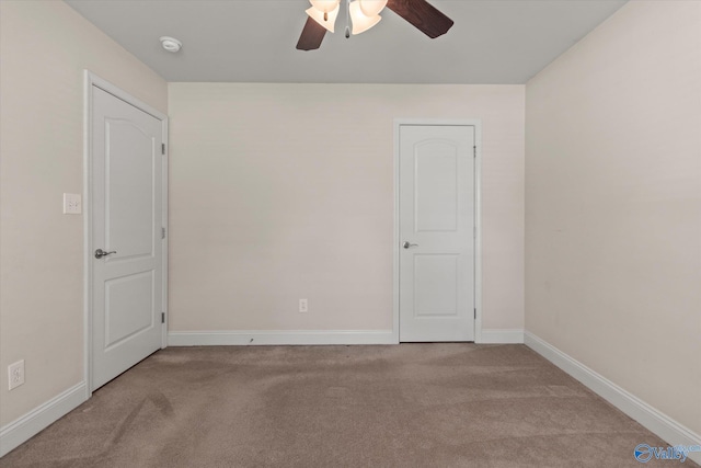 5008 Montauk Trl, Owens Cross Roads, AL 35763 - carpeted empty room with a ceiling fan, a smoke detector, and baseboards
