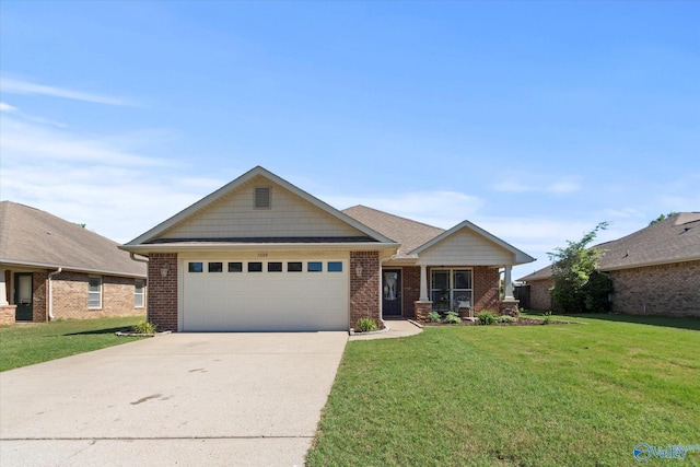 5008 Montauk Trl, Owens Cross Roads, AL 35763 - view of front of property with a garage, a front lawn, concrete driveway, and brick siding