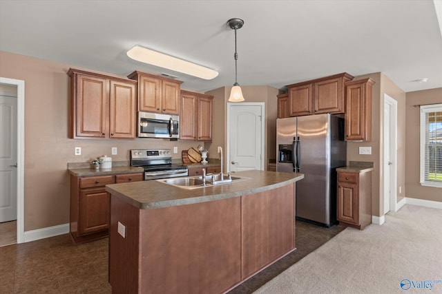 5008 Montauk Trl, Owens Cross Roads, AL 35763 - kitchen with appliances with stainless steel finishes, baseboards, a sink, and an island with sink