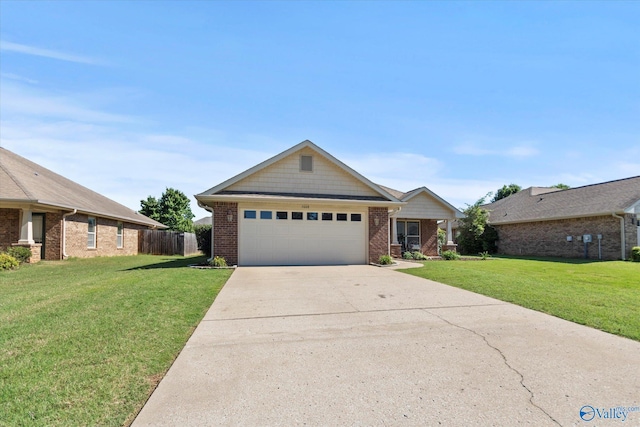 5008 Montauk Trl, Owens Cross Roads, AL 35763 - view of front of house with brick siding, concrete driveway, and a garage