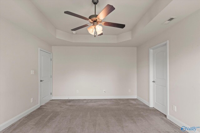 5008 Montauk Trl, Owens Cross Roads, AL 35763 - unfurnished room with a raised ceiling, ceiling fan, carpet flooring, and baseboards