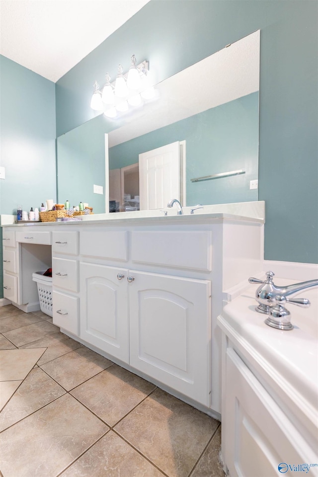 bathroom featuring tile patterned floors and vanity