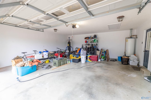 garage with a garage door opener and water heater