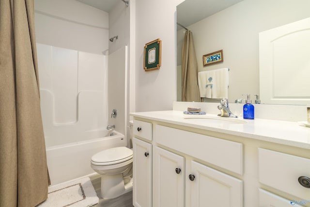 full bath with vanity, toilet, and shower / bath combo