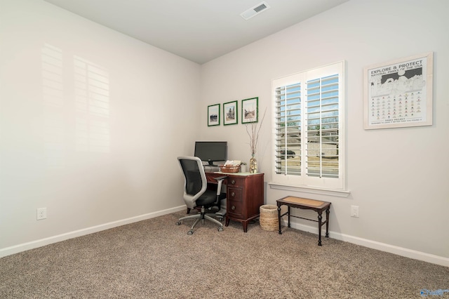 home office with visible vents, baseboards, and carpet