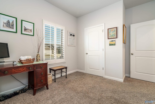 home office featuring light colored carpet and baseboards