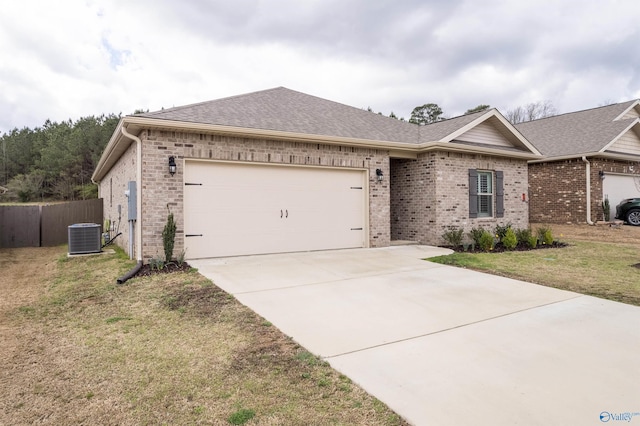 single story home with fence, driveway, a front lawn, a garage, and brick siding