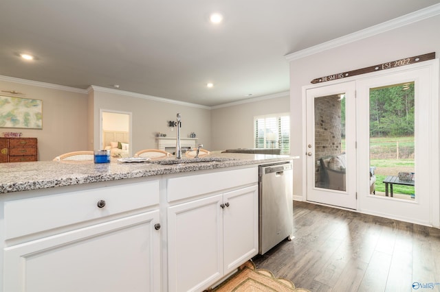 kitchen featuring light stone countertops, dark wood finished floors, ornamental molding, white cabinetry, and stainless steel dishwasher