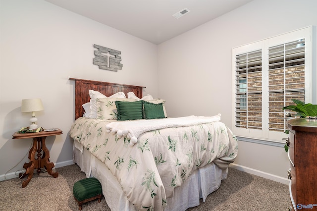 bedroom with visible vents, baseboards, and carpet