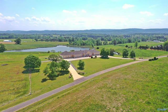 bird's eye view with a water view and a rural view