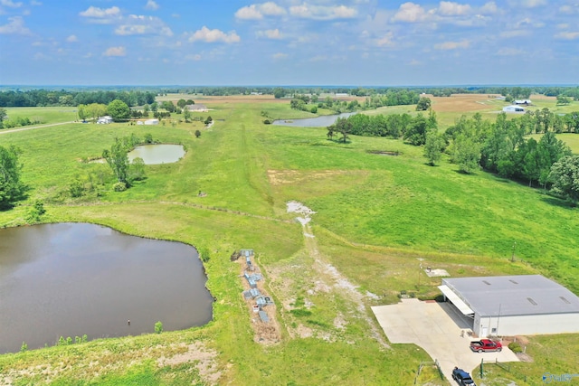 birds eye view of property with a water view and a rural view