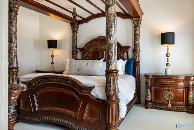 bedroom with carpet flooring and beamed ceiling