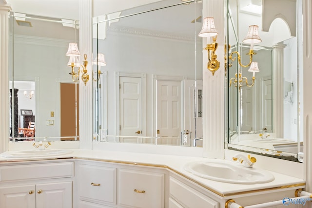 bathroom with vanity and crown molding