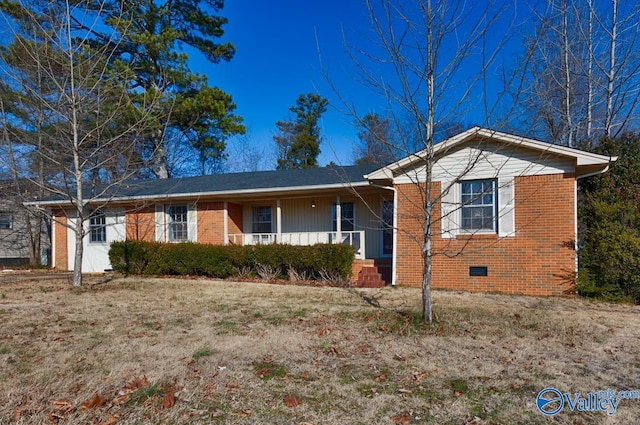 ranch-style house featuring a porch, crawl space, and brick siding