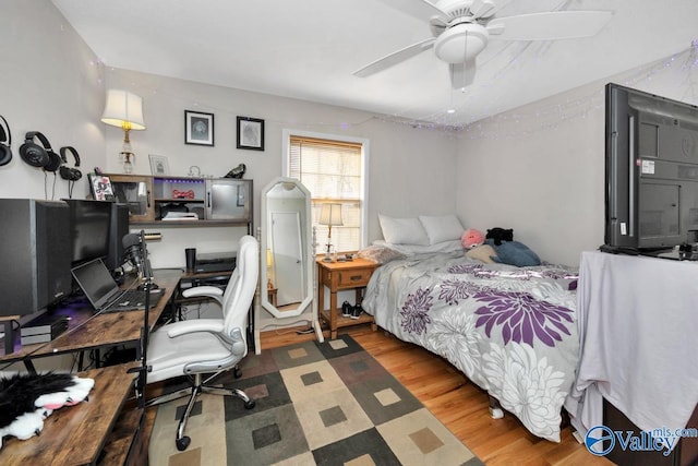 bedroom featuring ceiling fan and wood finished floors