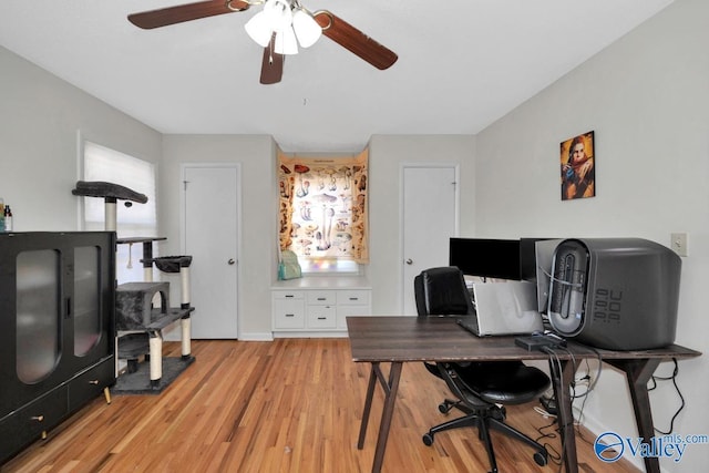 office with a ceiling fan and light wood-type flooring