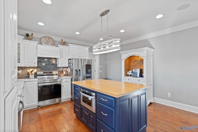 kitchen featuring a center island, appliances with stainless steel finishes, white cabinetry, blue cabinets, and decorative light fixtures