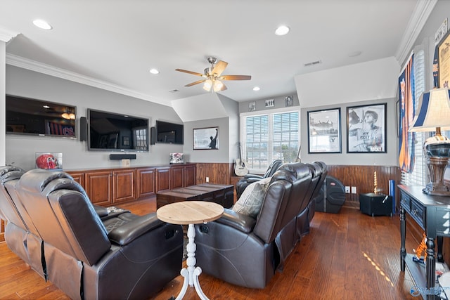 living room with ceiling fan, crown molding, and dark wood-type flooring