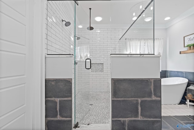 bathroom featuring plus walk in shower and ornamental molding