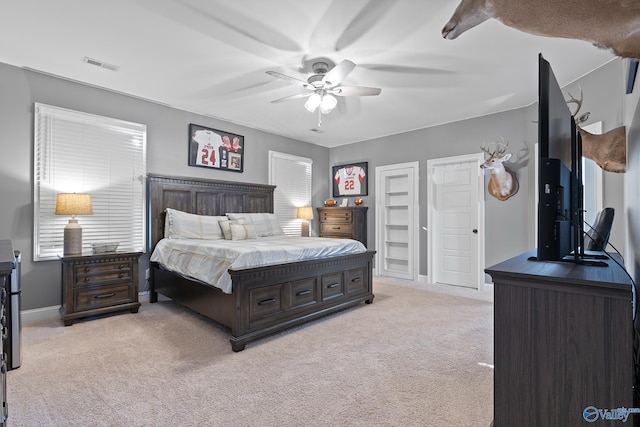 bedroom featuring light carpet and ceiling fan