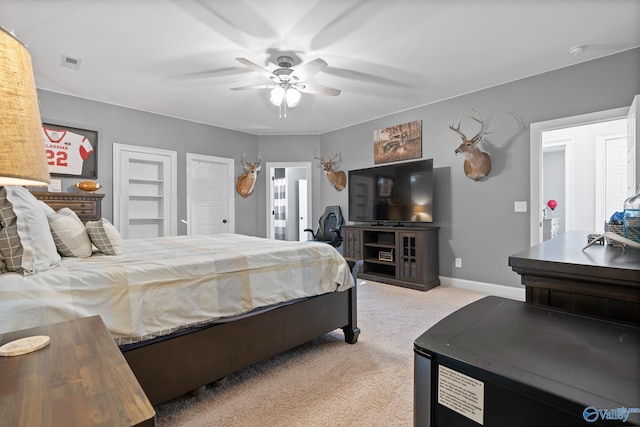 carpeted bedroom featuring ceiling fan