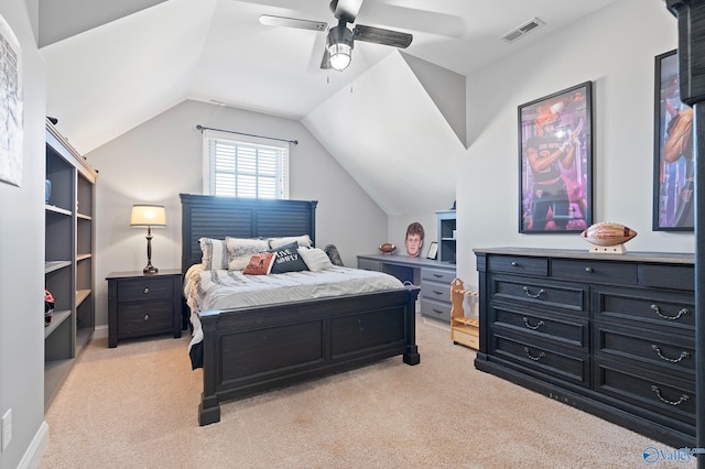 carpeted bedroom with ceiling fan and vaulted ceiling