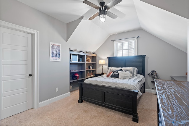 carpeted bedroom featuring ceiling fan and vaulted ceiling