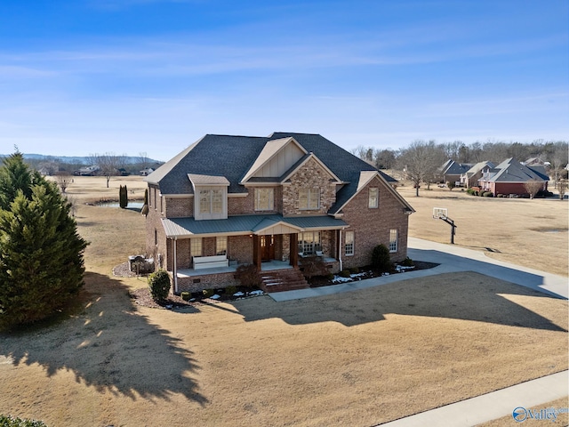 view of property featuring covered porch