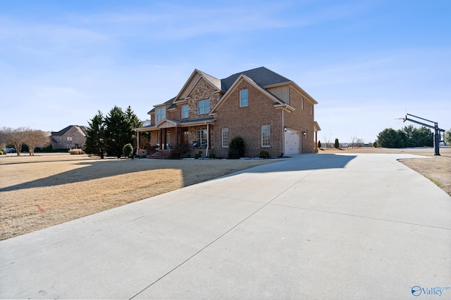 view of front of property with a garage and covered porch