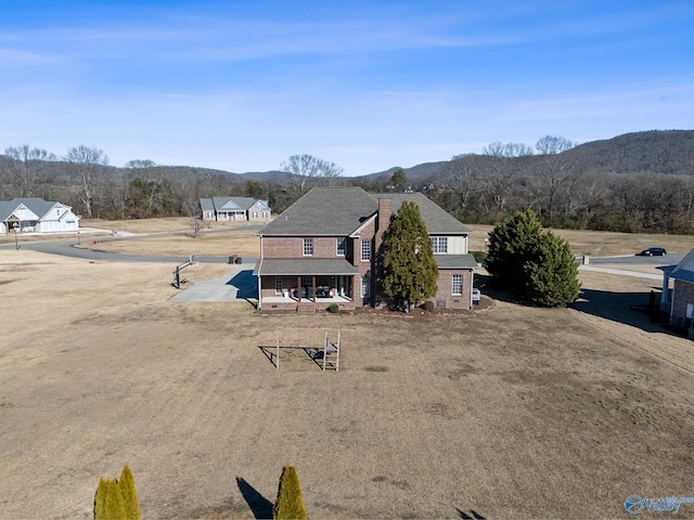 exterior space featuring a mountain view