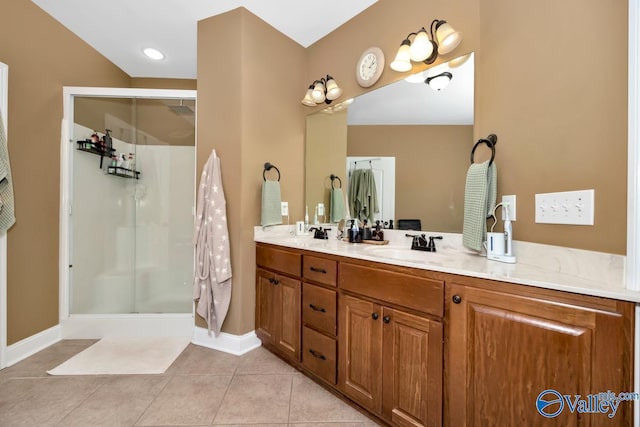 bathroom with tile patterned flooring, vanity, and an enclosed shower