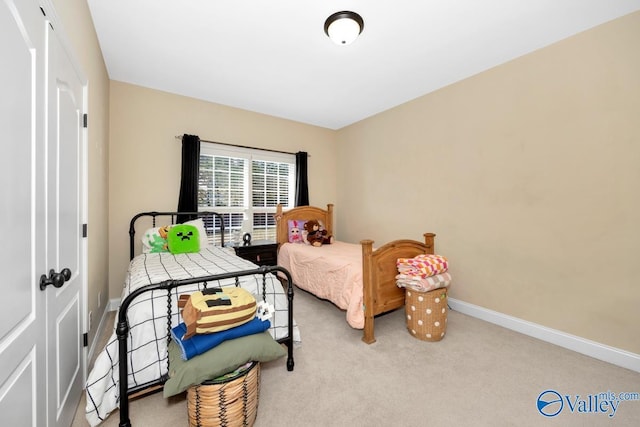 bedroom with light carpet