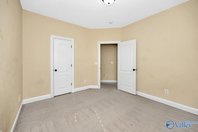 unfurnished bedroom with light carpet