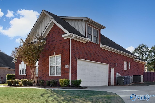 view of side of property featuring cooling unit and a garage