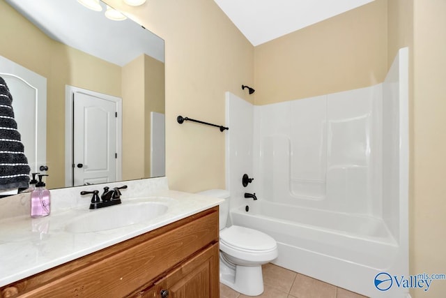 full bathroom featuring tile patterned floors, vanity, toilet, and bathtub / shower combination