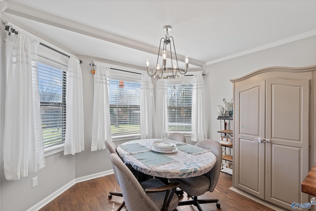 dining room featuring baseboards, a notable chandelier, dark wood-style flooring, and ornamental molding