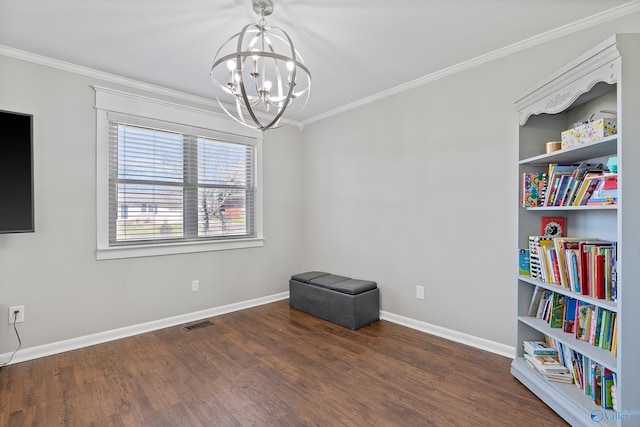 interior space with crown molding, visible vents, a notable chandelier, and wood finished floors