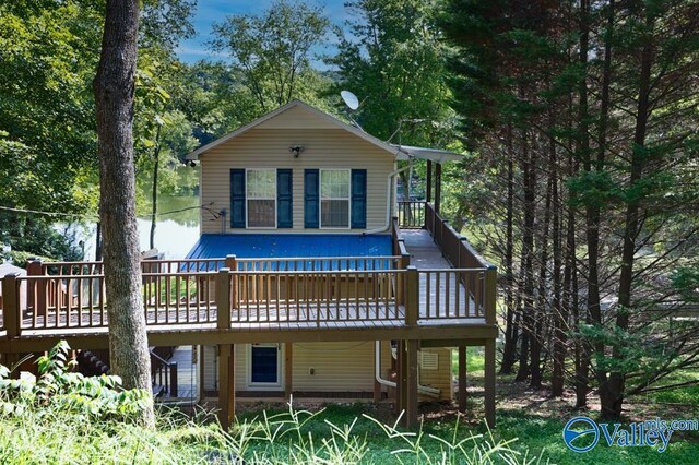 back of house with a wooden deck