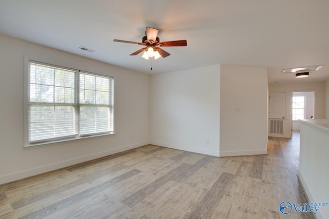 unfurnished room with ceiling fan and light hardwood / wood-style floors