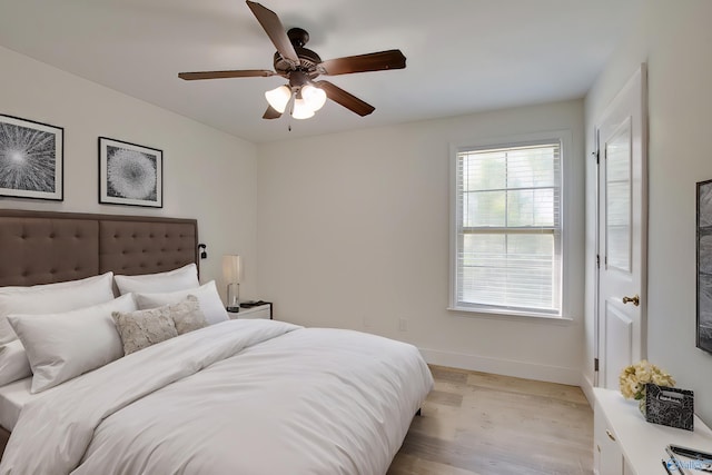 bedroom featuring light wood-type flooring and ceiling fan