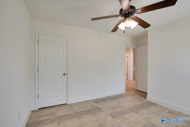 empty room featuring ceiling fan and light wood-type flooring